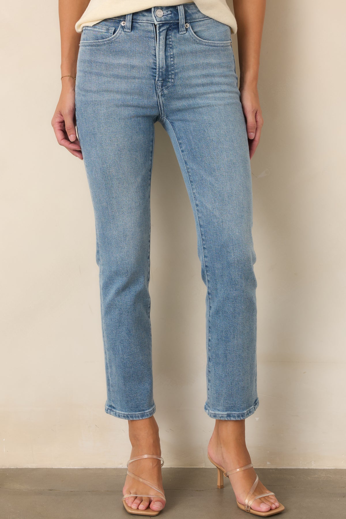 Slim-straight legs create a polished, streamlined shape from the contoured upper fit through the hem.