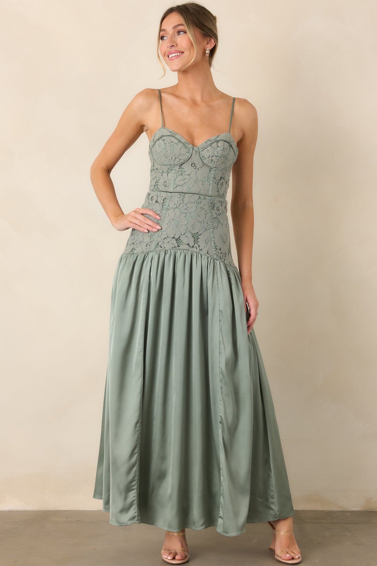 Slim-strap maxi dress with an elongated silhouette and soft skirt fullness.