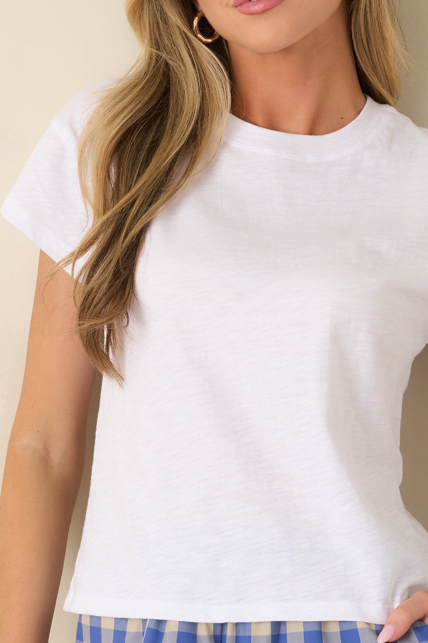 Detailed view of the soft slub fabric, crew neckline, and lightweight jersey construction.