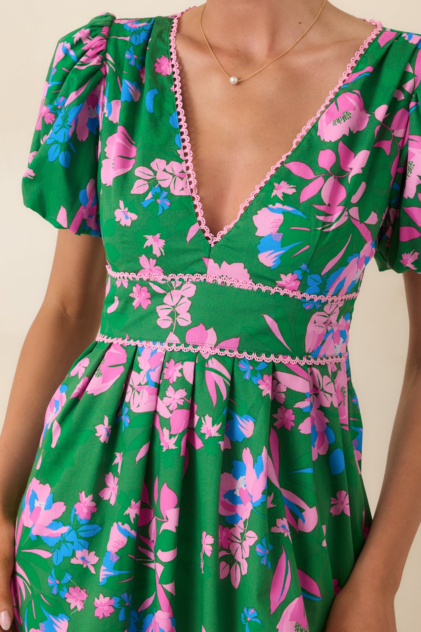 Detailed look at the smocked back waist and delicate tie closure at the open back.