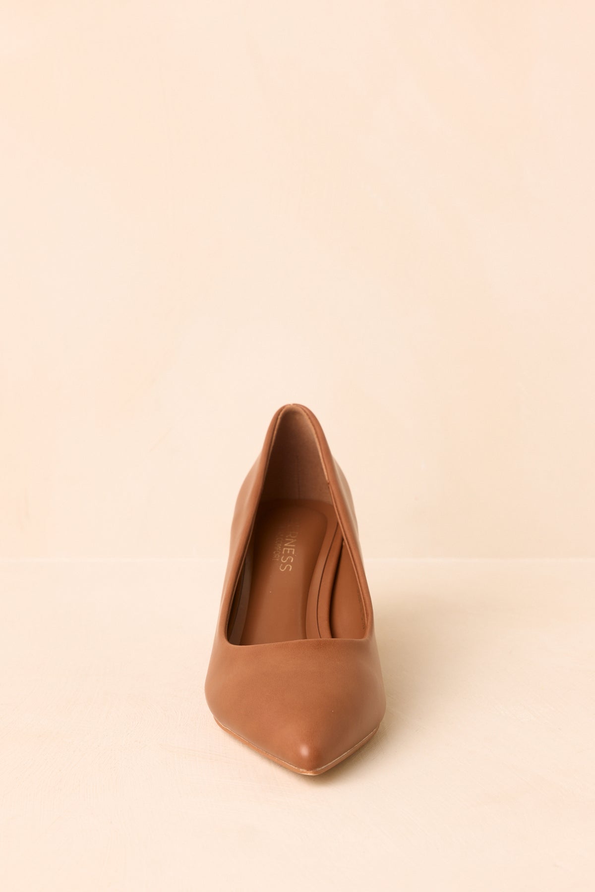 Smooth-finish camel heels featuring a pointed toe and classic covered heel.