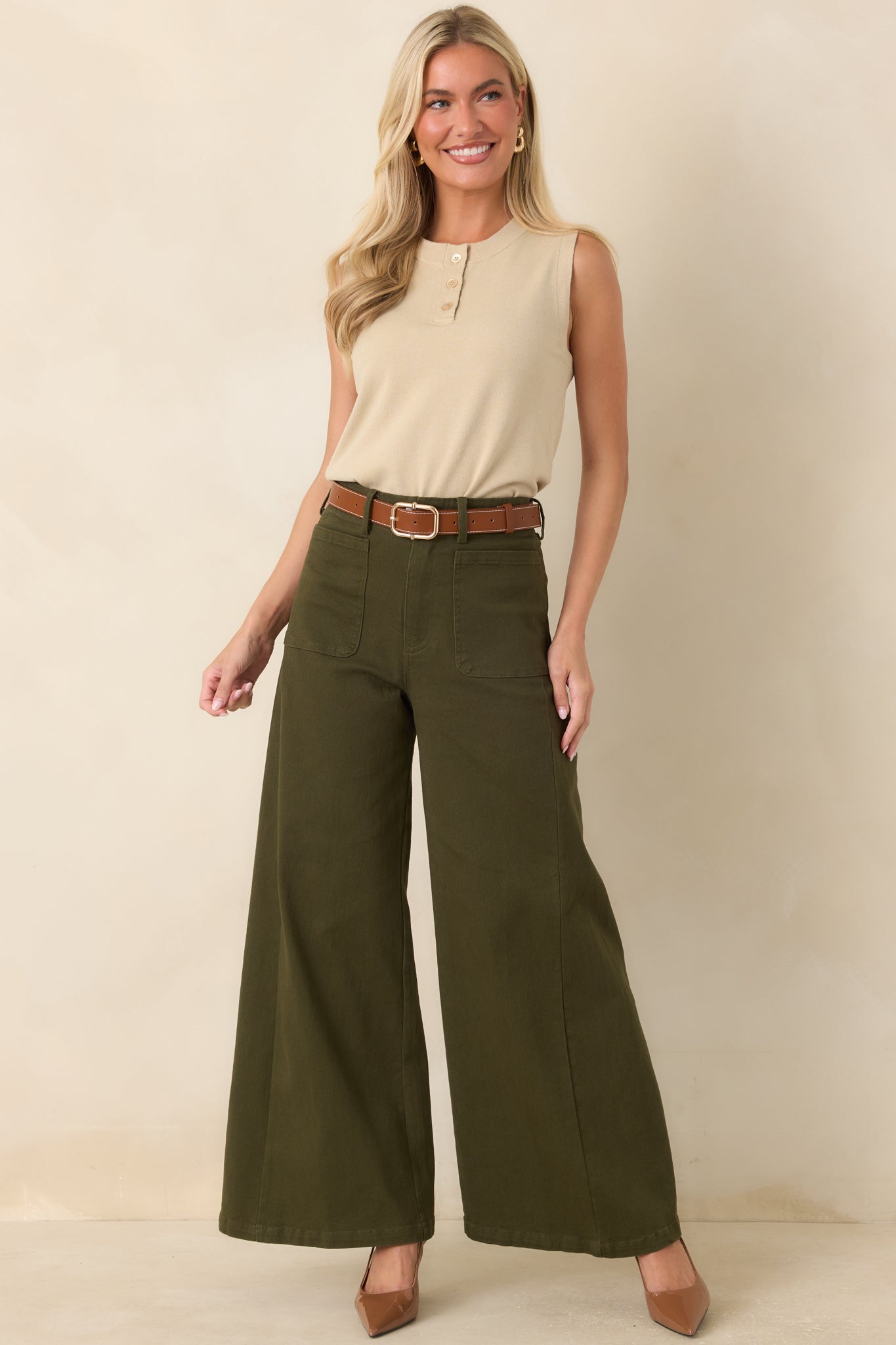 Full view highlighting the smooth cotton blend fabric and structured construction of the high-rise pants.