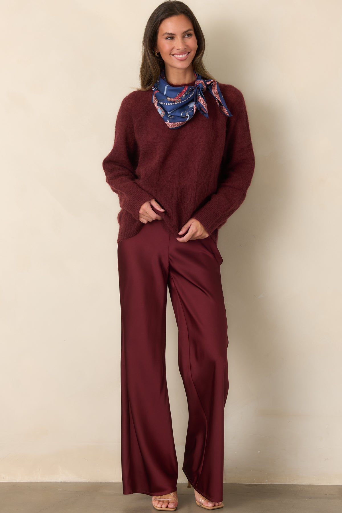 High-rise pants with a smooth flat-front waistband and full-length wide legs that create an airy, flowing shape.