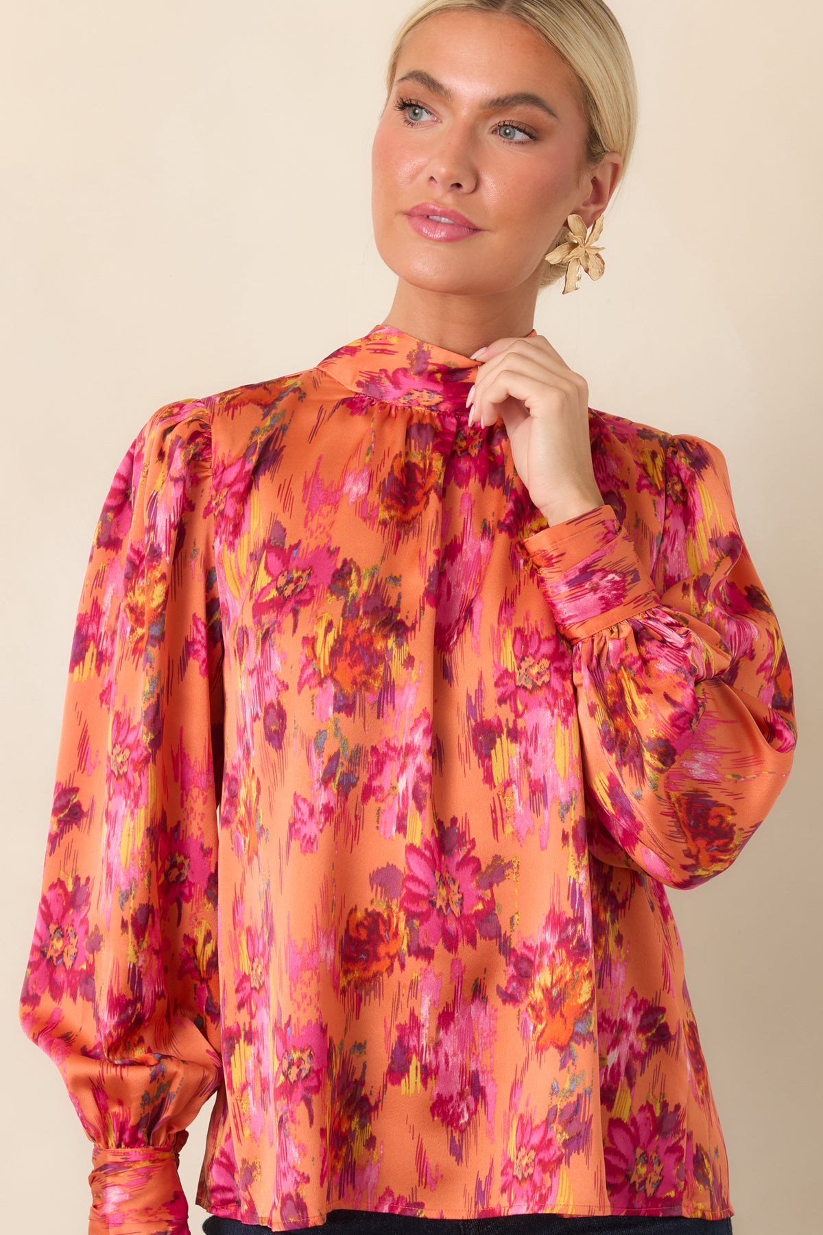 Close view of the colorful top emphasizing its smooth satin texture, subtle sheen, and relaxed flowing silhouette.