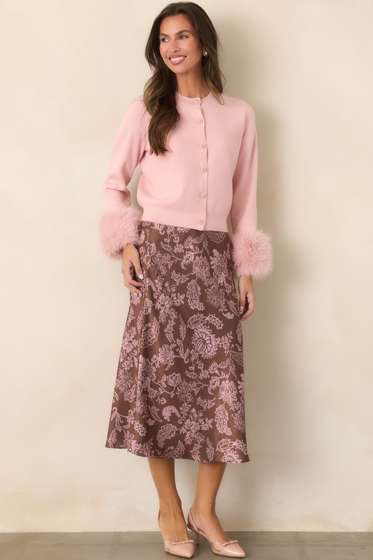 Smooth satin skirt with a comfortable elastic waistband and softly flared midi silhouette.