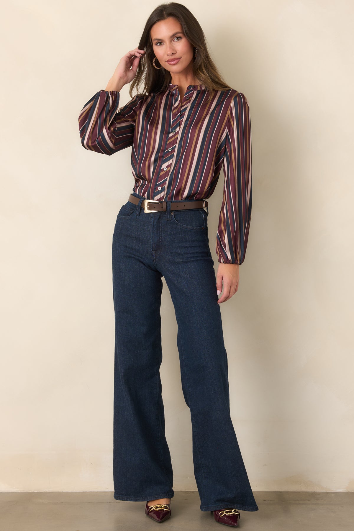 Smooth satin blouse showcasing vintage-inspired stripes and a relaxed shape.
