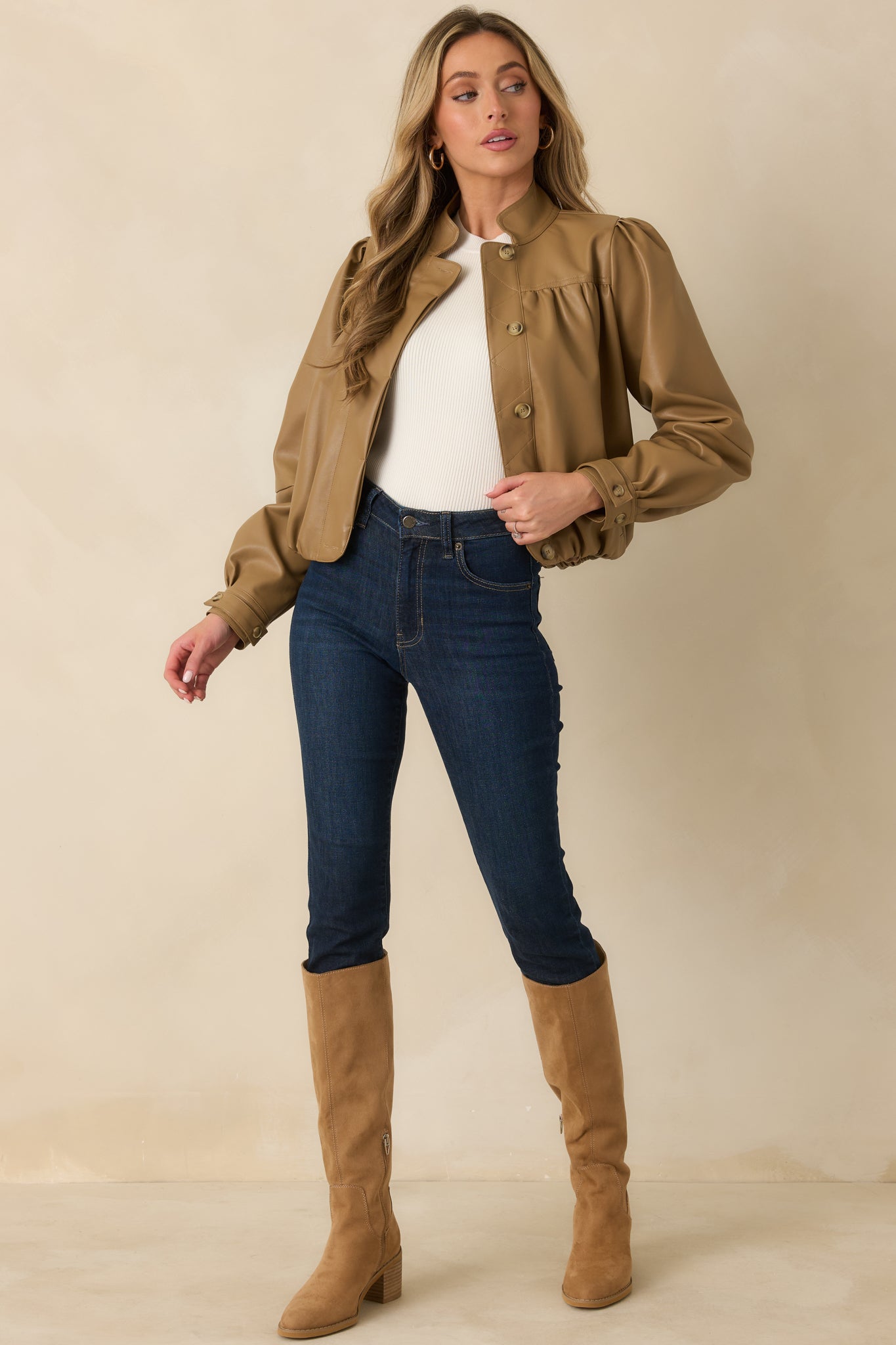 Smooth vegan leather jacket with long puff sleeves, buttoned cuffs, a rounded stand collar, and softly gathered yoke detailing.