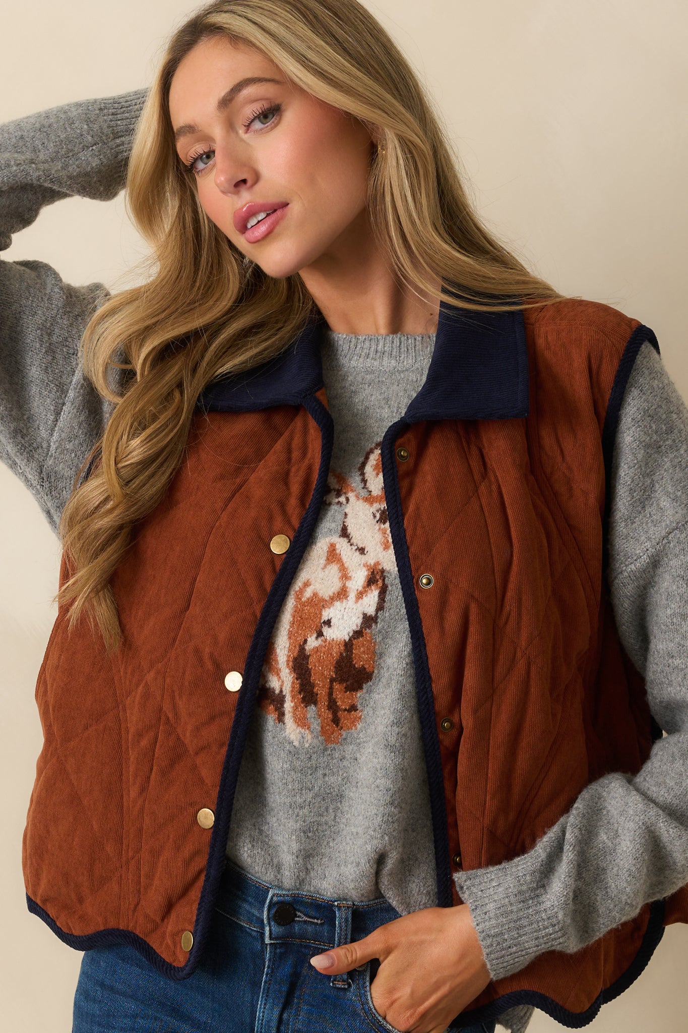 Close-up of the snap button closure and contrast navy collar.