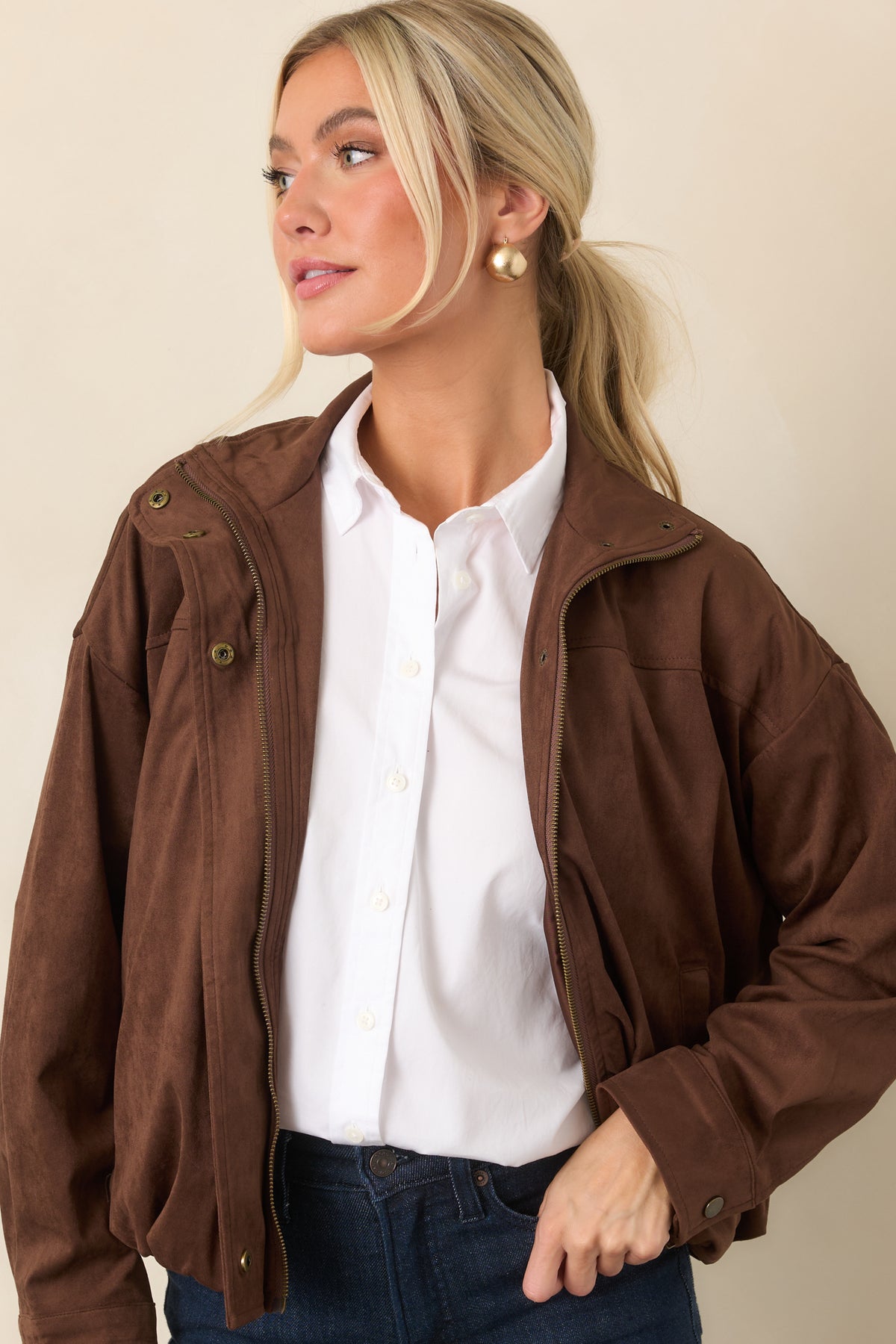 Soft chocolate faux suede creates a relaxed jacket shape with dropped shoulders and roomy sleeves.