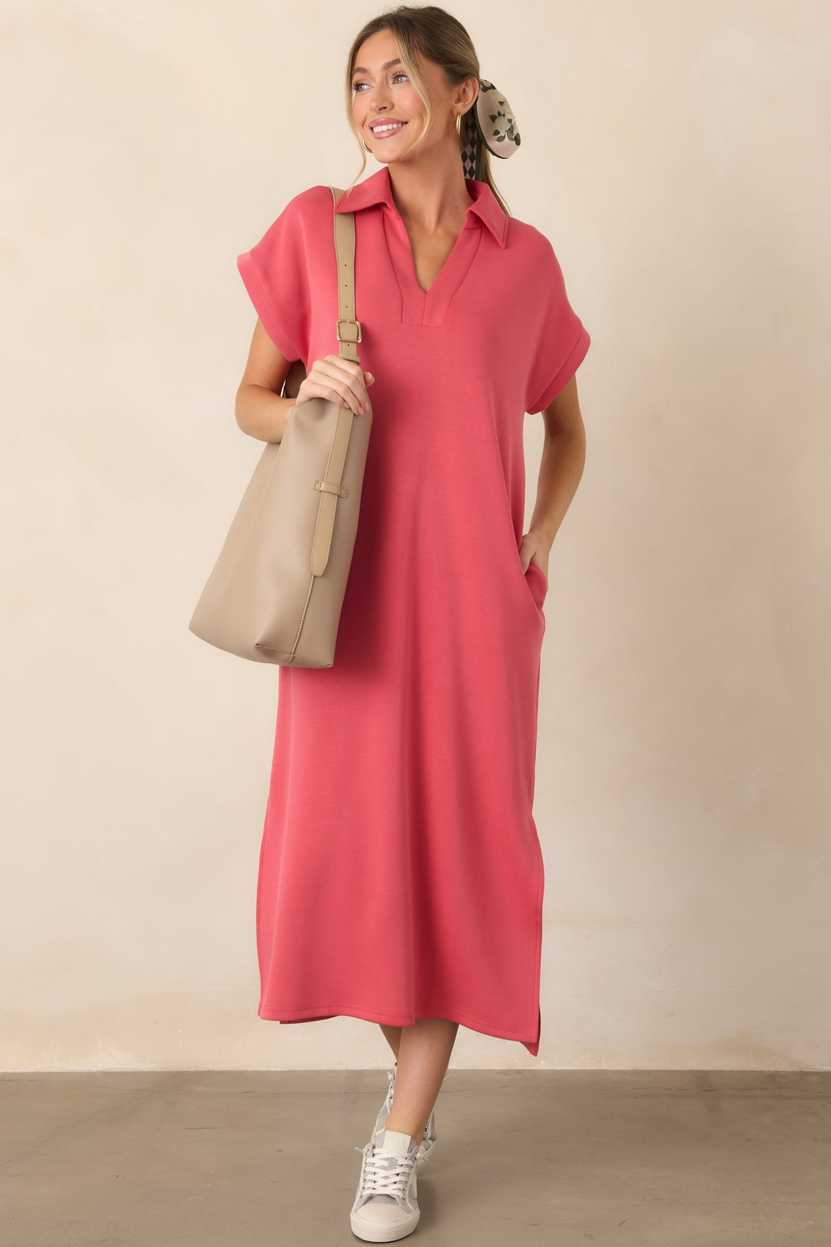 Soft coral pink midi dress featuring a relaxed silhouette, short sleeves, collared V-neckline, and convenient side pockets.