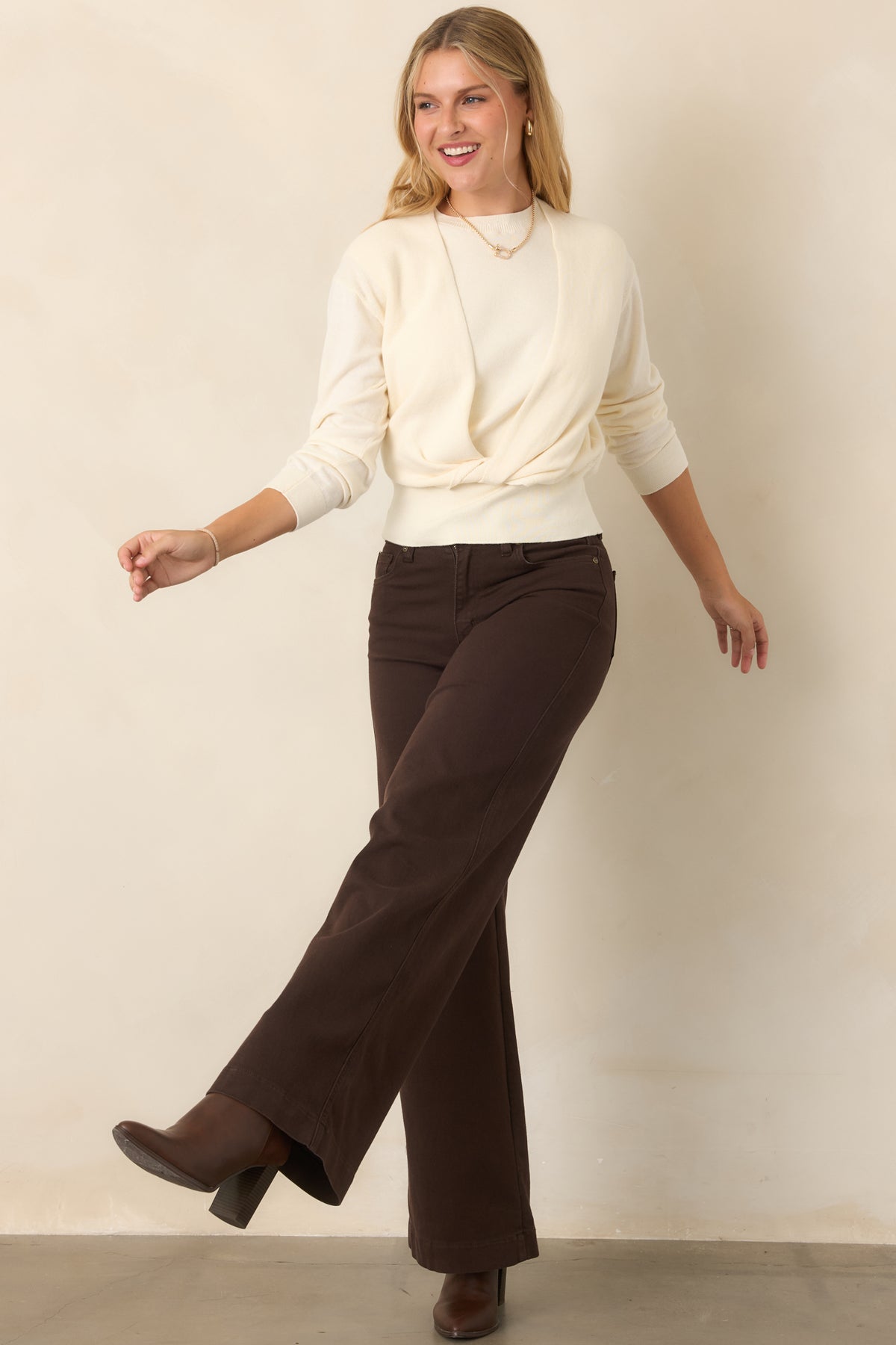 Soft cotton-and-cashmere sweater designed with a sleeveless knit base and coordinating long sleeves that cross and twist at the front.