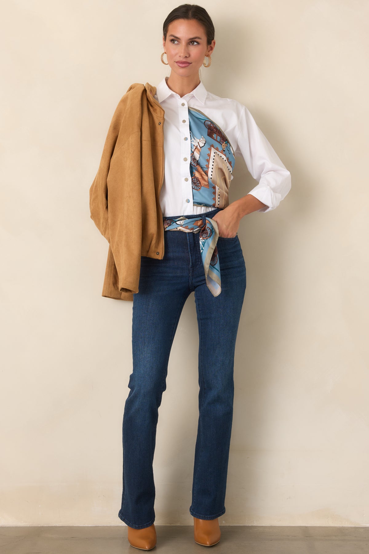 Soft faux suede jacket featuring dropped shoulders, subtle seam detailing, and a relaxed blouson silhouette.