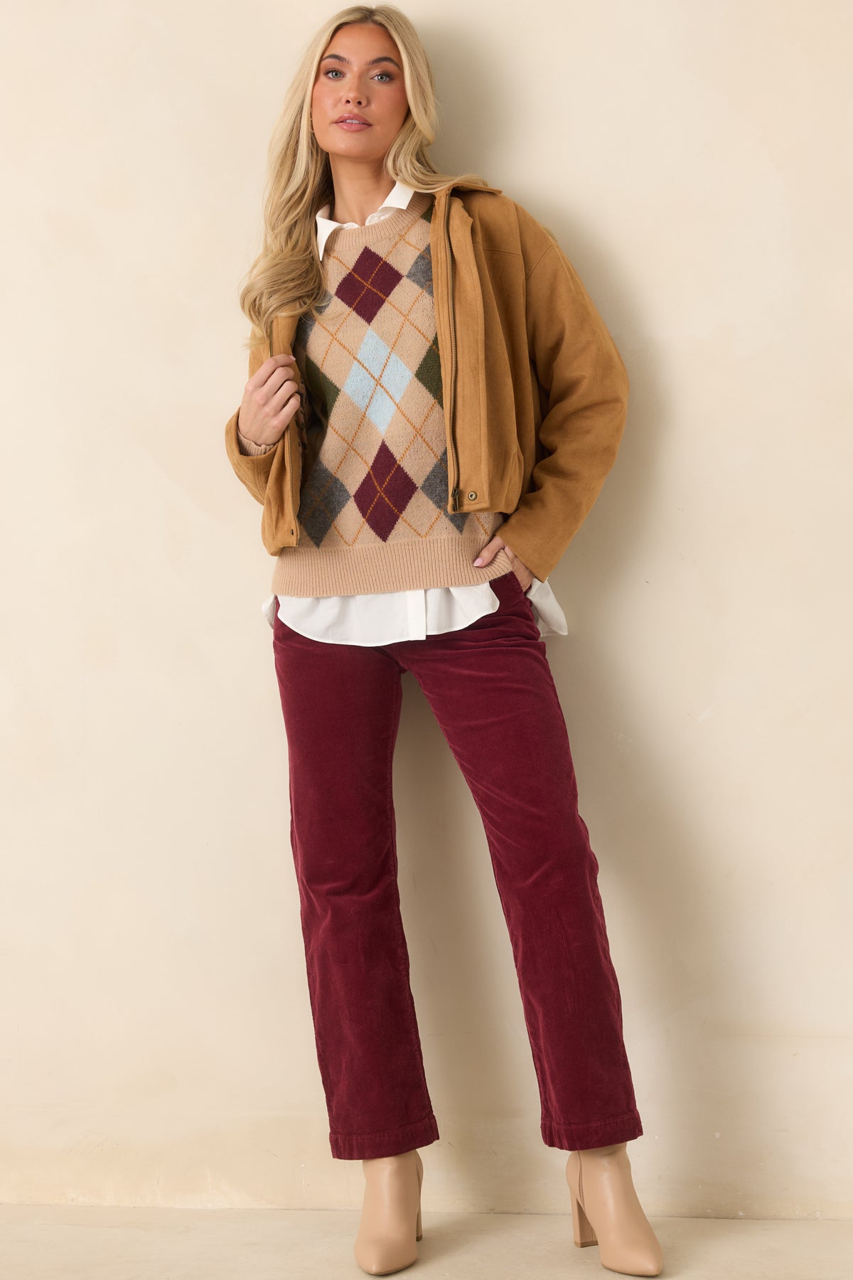 Relaxed faux suede jacket combines a structured pointed collar with a softly gathered hem and smooth, stretchy fabric.