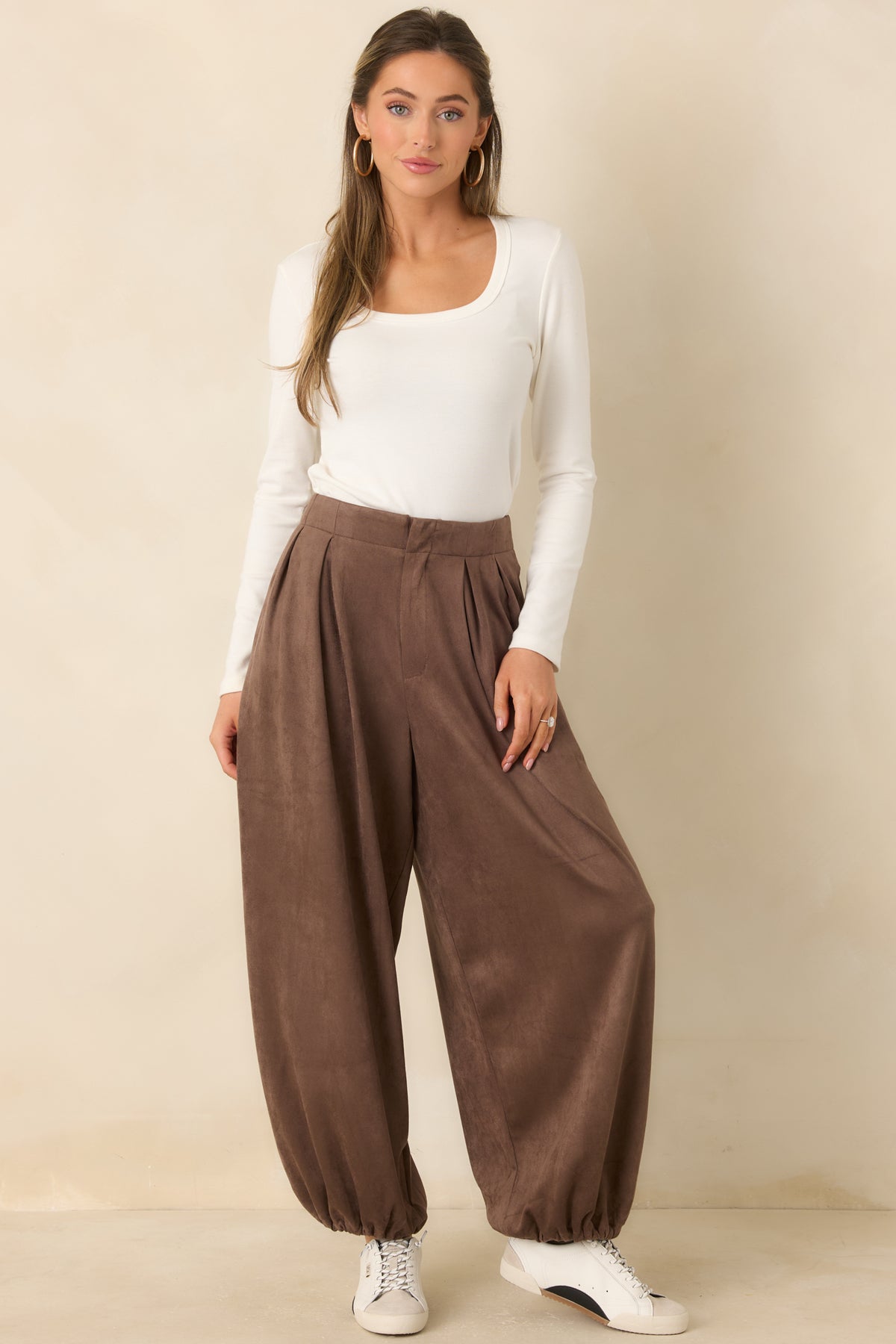 Soft faux suede pants featuring a relaxed balloon silhouette and a flat waistband.