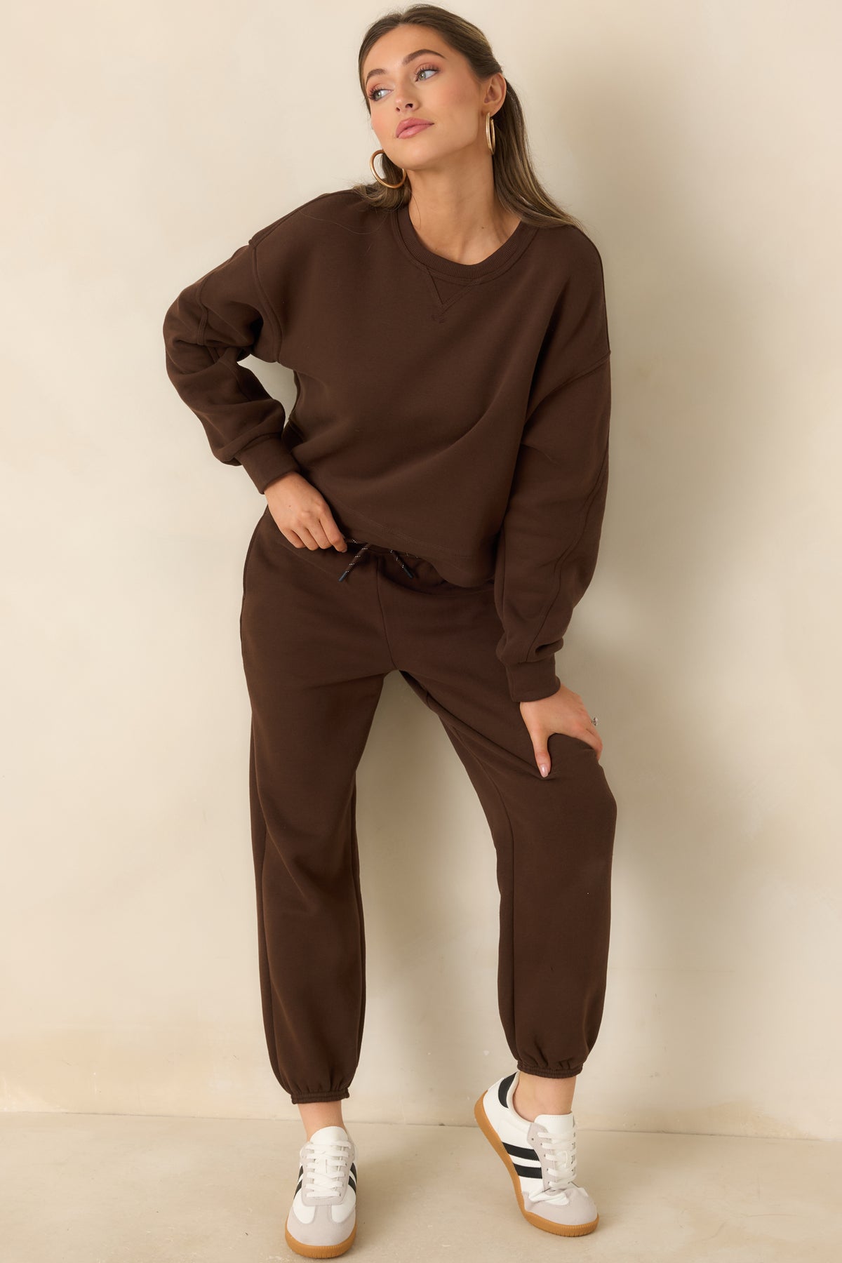 Soft fleece top featuring a laid-back silhouette and ribbed trim around the neckline and cuffs.