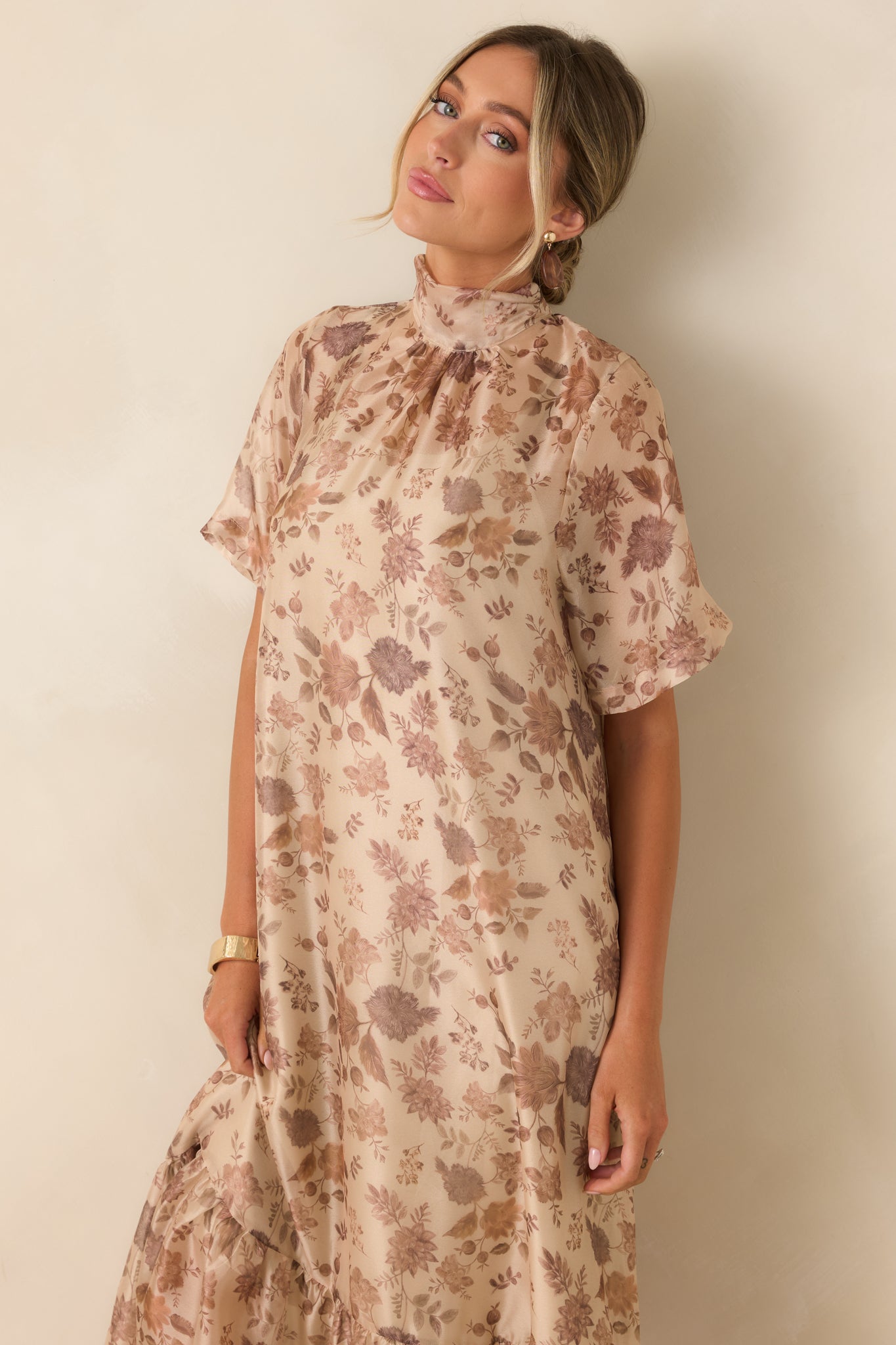 Soft floral dress showcasing a lightweight layered design, adjustable straps, tiered skirt, and elegant floor-length movement.