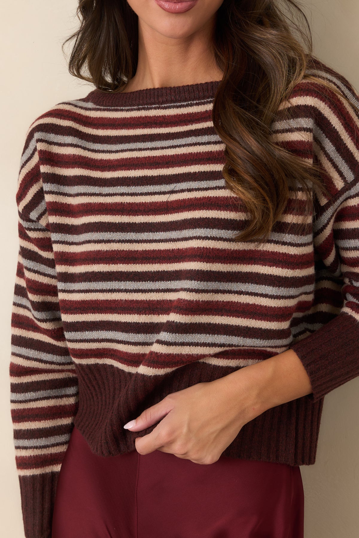 Soft knit top showcasing the broad ribbed hem and deep ribbed sleeve cuffs.
