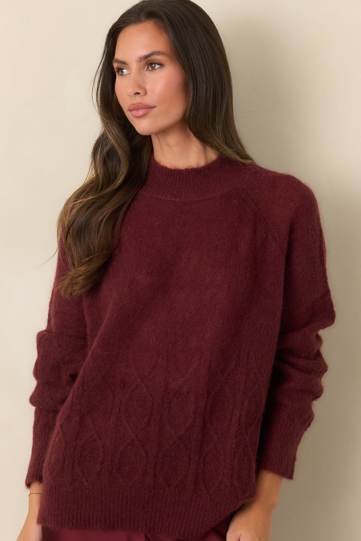 Soft knit top showcasing the cable detailing, lightweight construction, and subtle stretch.