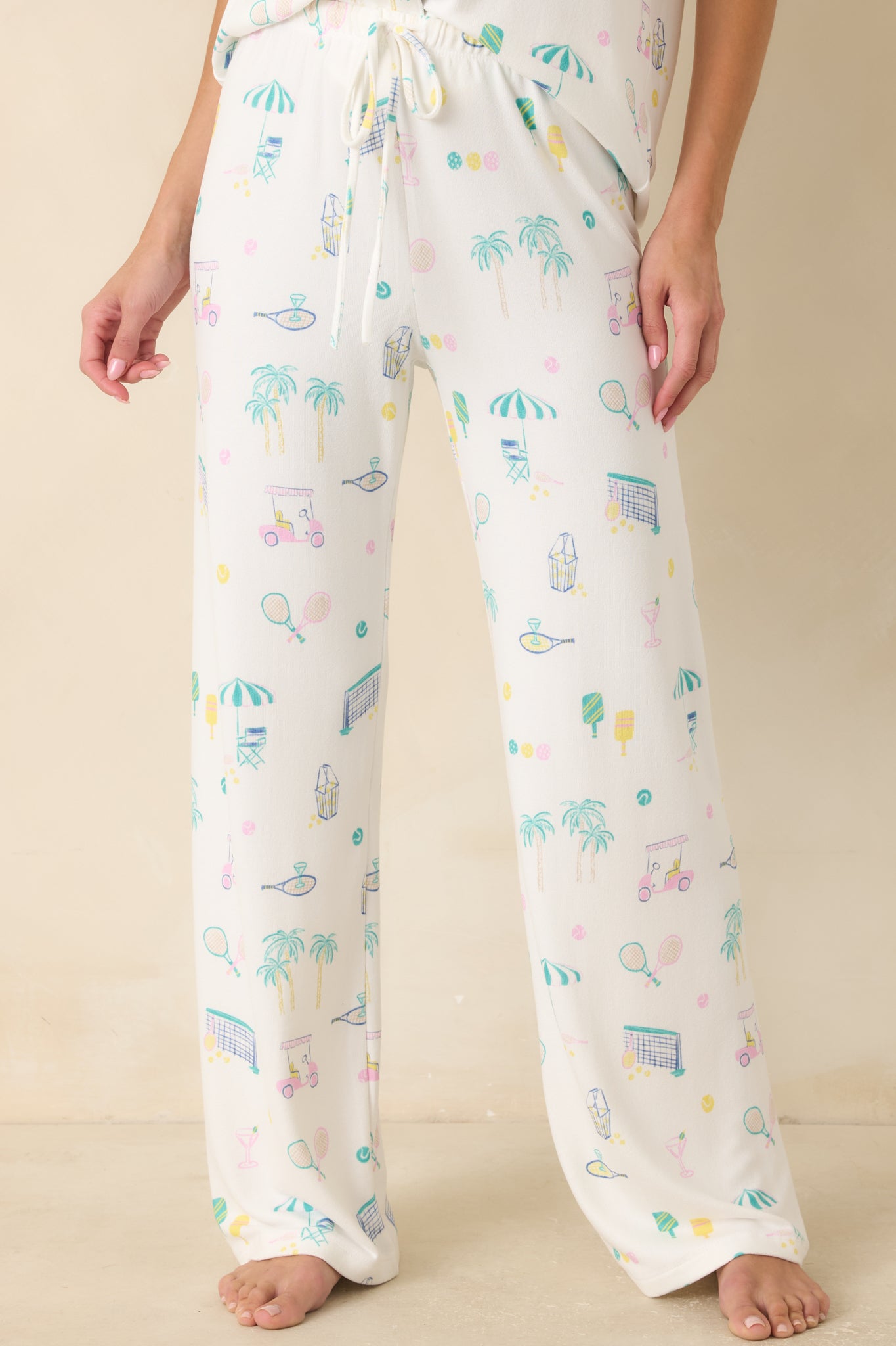 Detailed look at the ultra-soft knit fabric, relaxed wide-leg shape, and playful court sports-inspired artwork.