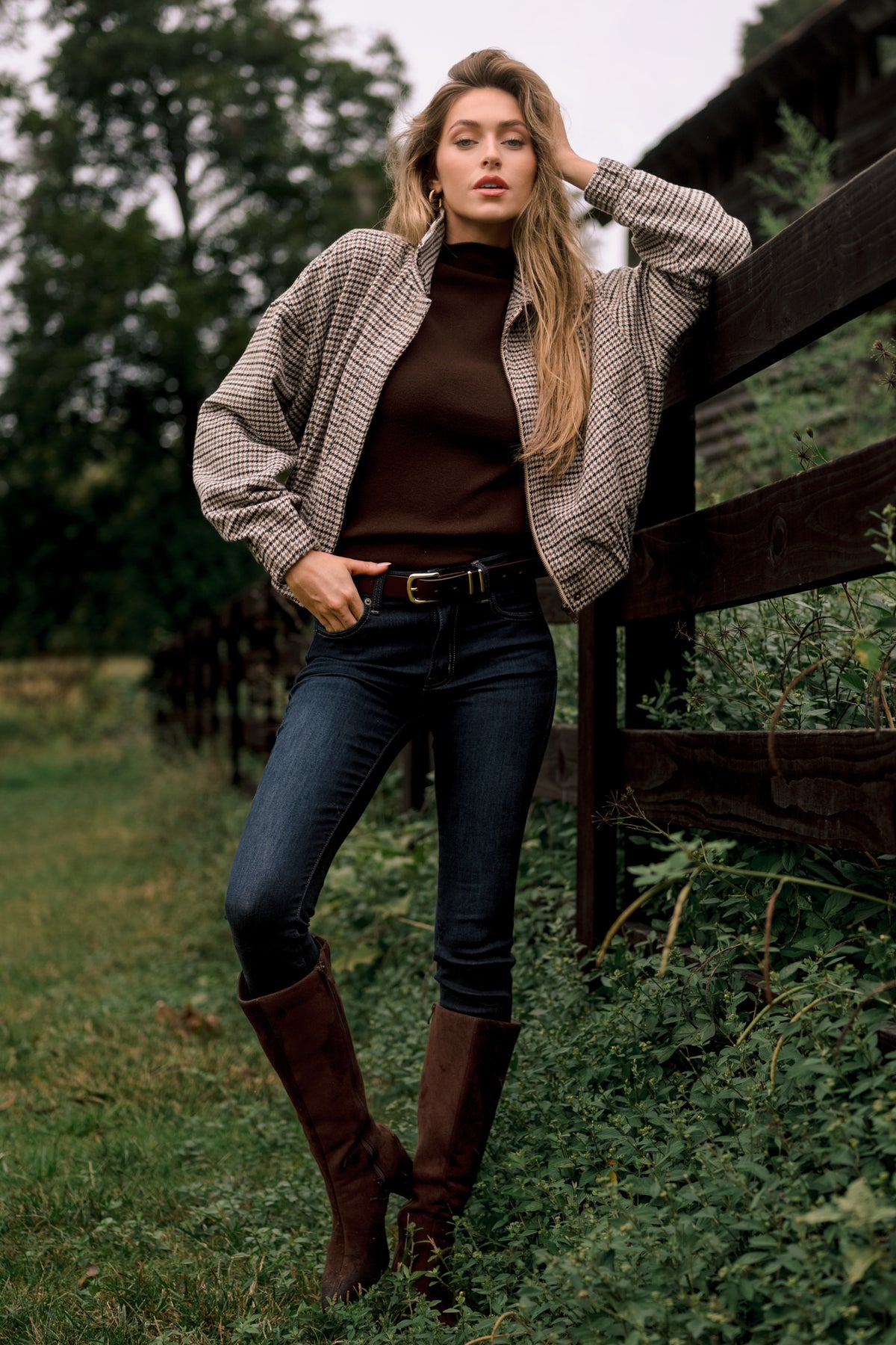 Soft knit top with a high turtleneck neckline, short sleeves, and a clean streamlined silhouette.