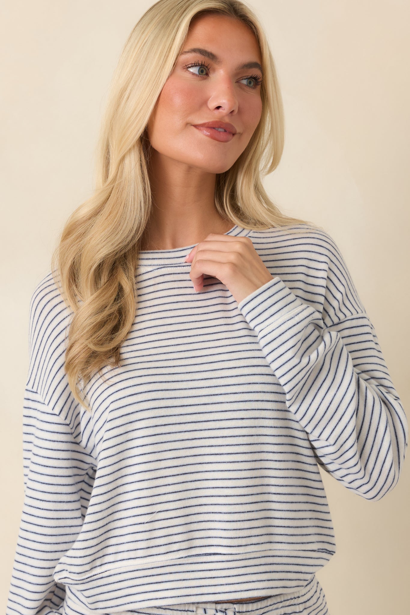 Soft knit pullover featuring lightweight warmth, classic stripes, and a comfortable relaxed silhouette.