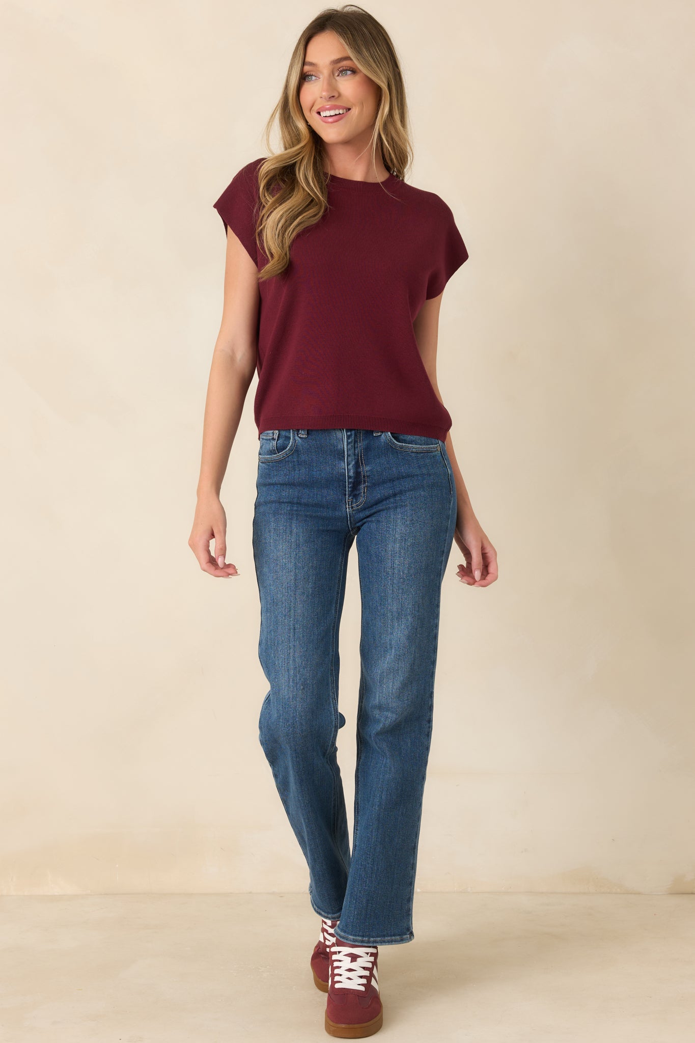 Soft knit top with a polished crew neck, short sleeves, straight-cut shape, and clean ribbed edges for an easy everyday look.