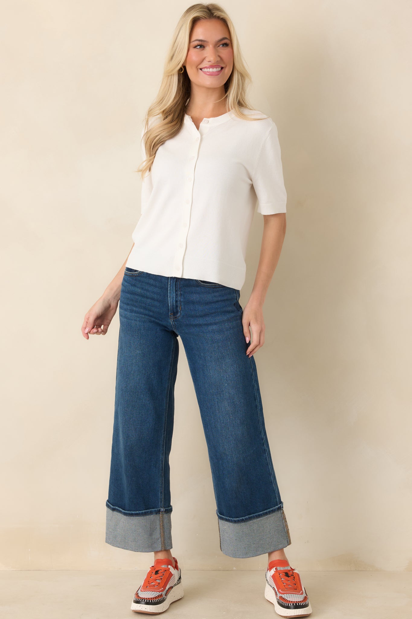 Soft knit short sleeve top featuring classic front button closure.