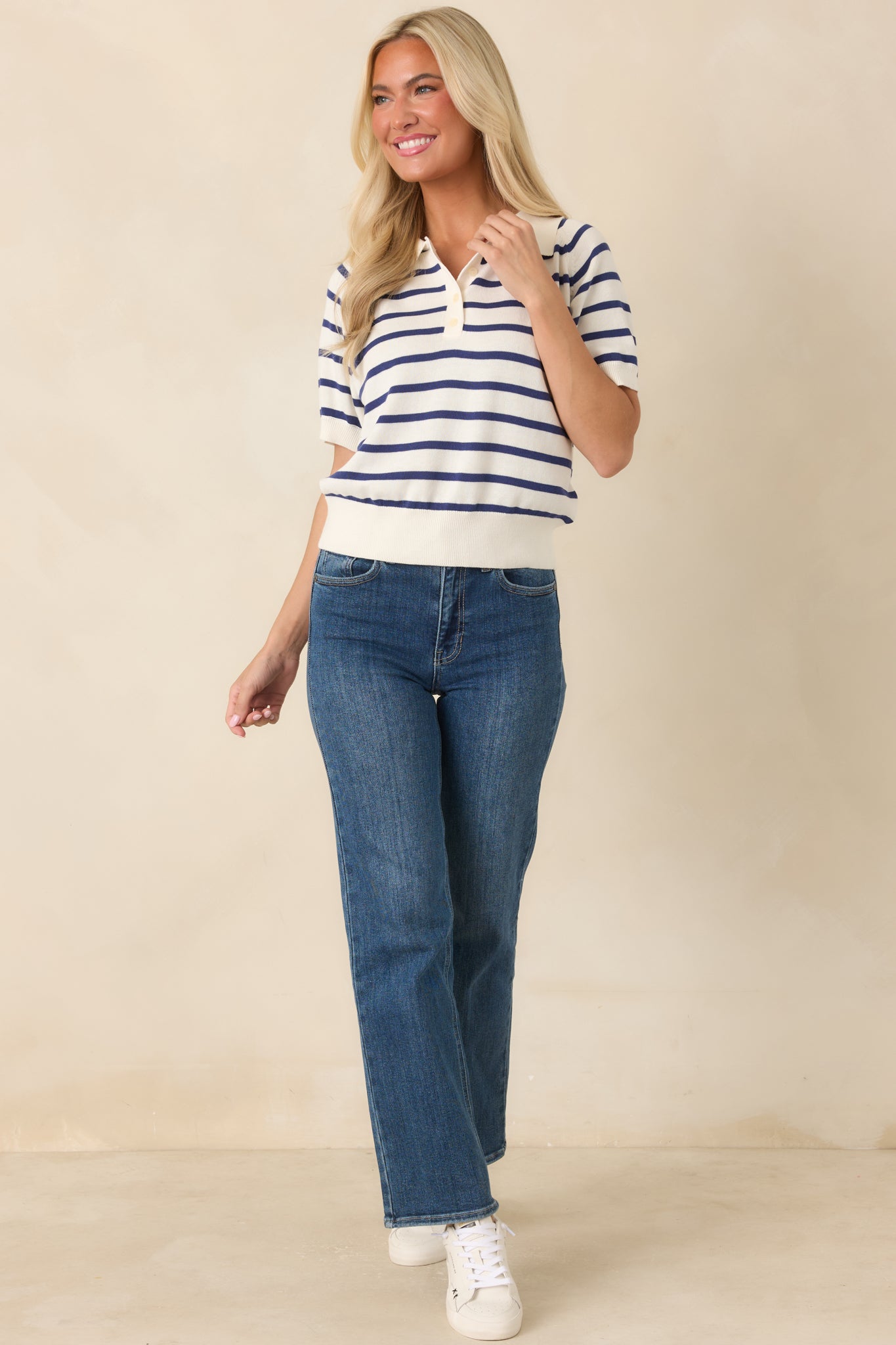 Soft knit top with short sleeves, ribbed edging, and a relaxed silhouette for everyday styling.