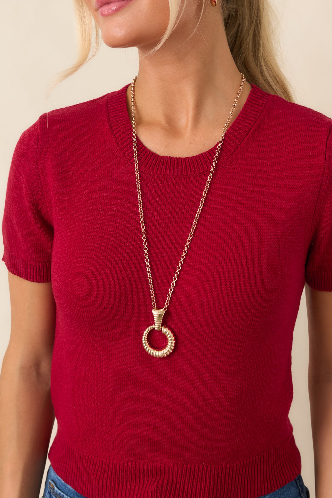 Close-up of the soft rayon-blend knit fabric and ribbed trim, showcasing the texture and clean finishing details.