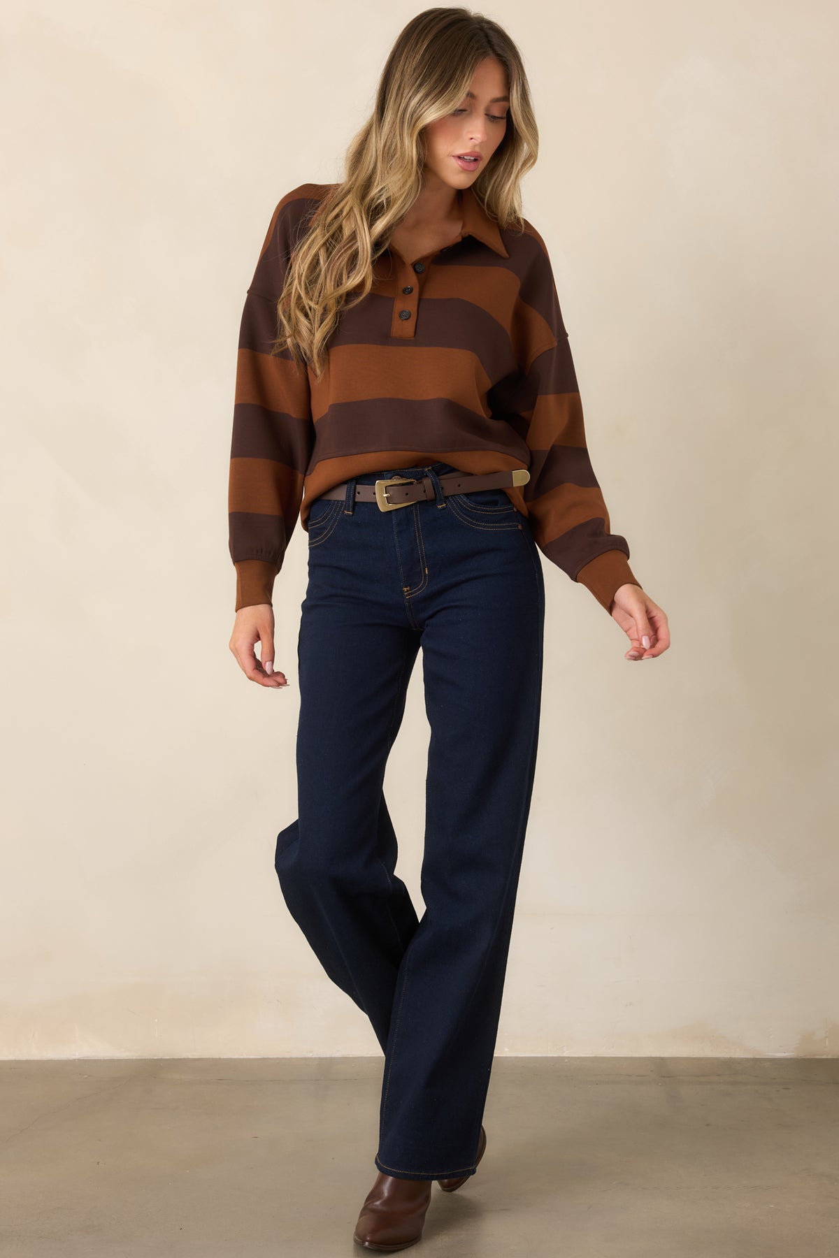 Soft spacer fabric top showcasing wide horizontal stripes, a button placket, relaxed silhouette, and banded hem.