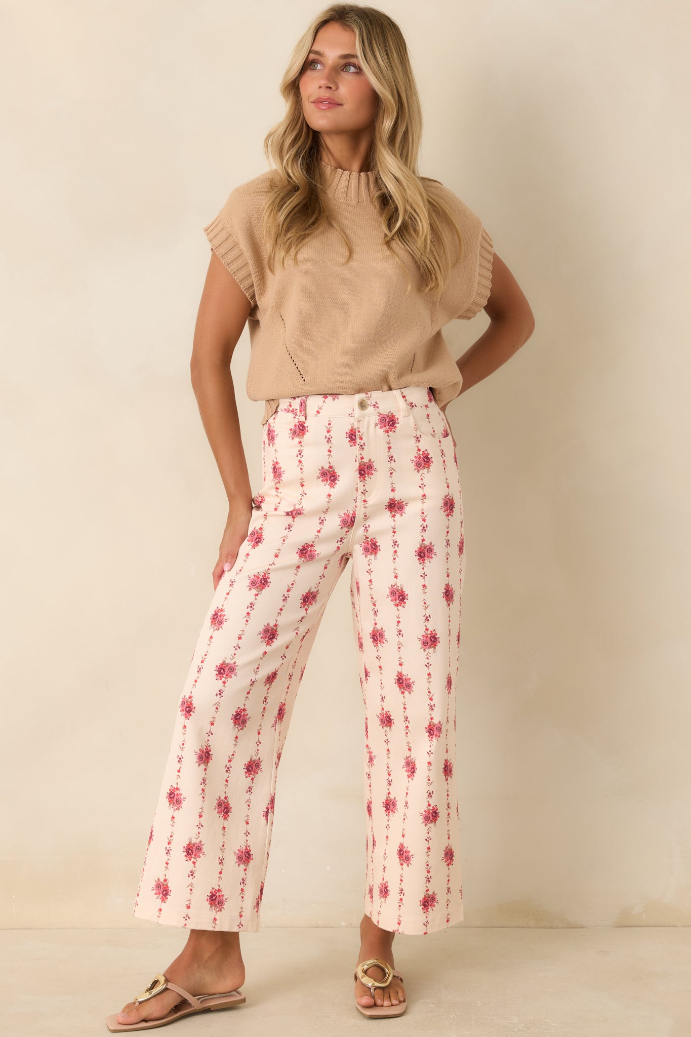 Soft tan knit sweater featuring a mock neckline, short sleeves, relaxed boxy silhouette, and ribbed trim at the neckline and hem.