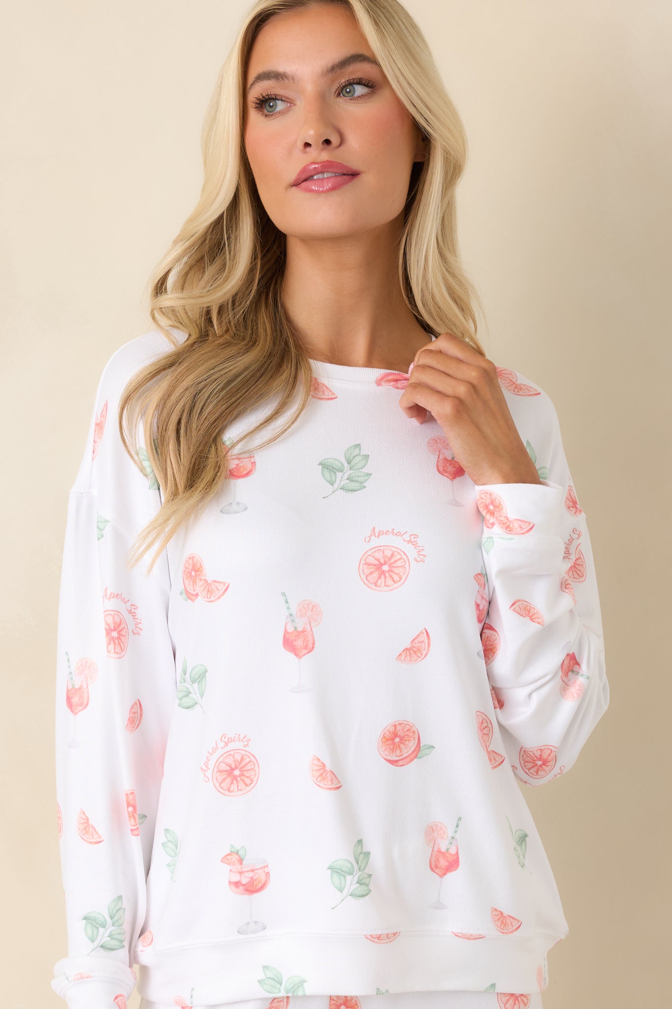 Soft white pajama top showcasing vibrant citrus design and relaxed fit.