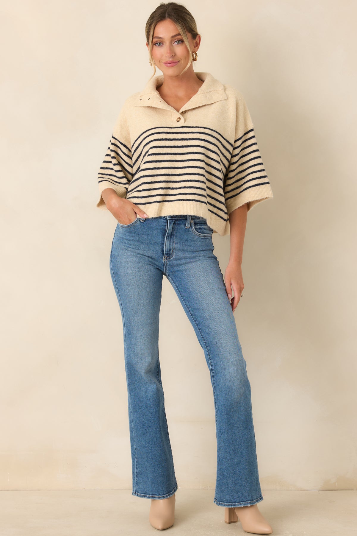 Softly brushed top with dropped shoulders, elbow-length sleeves, and a relaxed oversized silhouette.