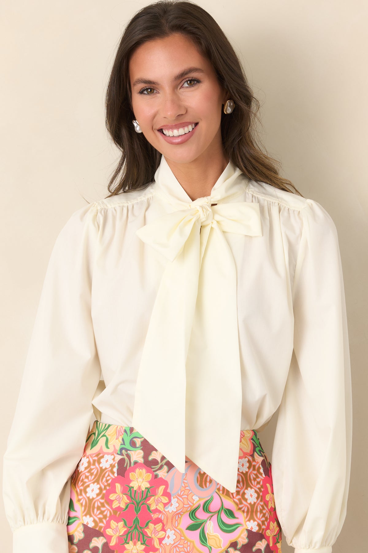 Softly gathered shoulder detailing adds shape to the relaxed blouse.