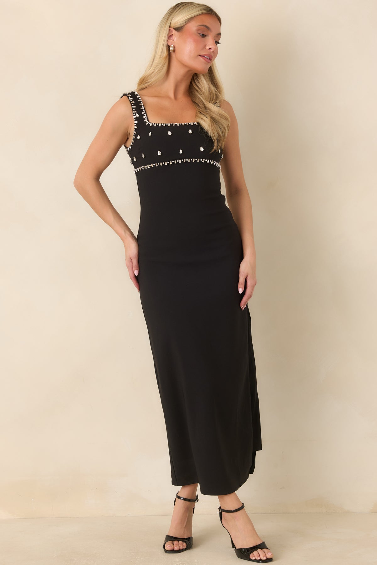Fitted midi dress with sparkling rhinestone detailing across the bodice and wide shoulder straps.