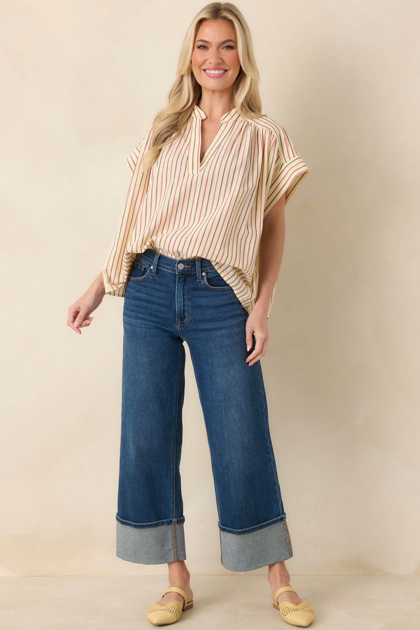 Split V-neck top with subtle stand collar and short dolman sleeves.