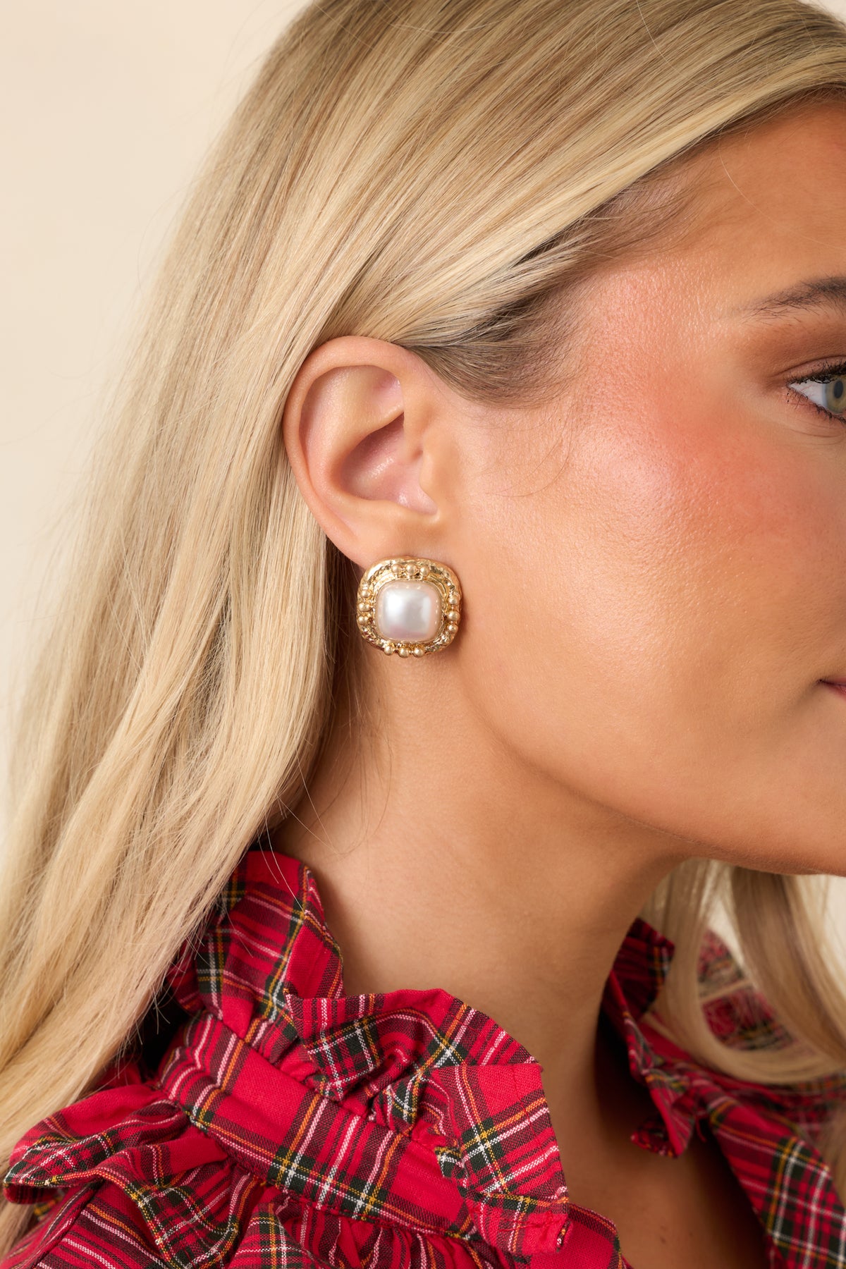 Softly rounded square earrings with glossy pearl centers surrounded by intricate gold-tone beaded edging.