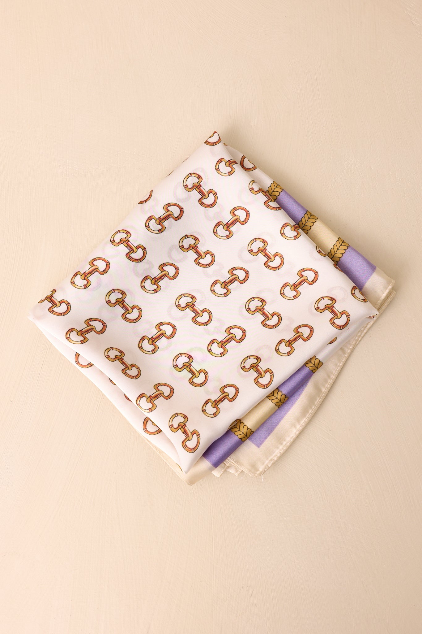 Front-facing image of the square scarf, highlighting the satin finish and border design.