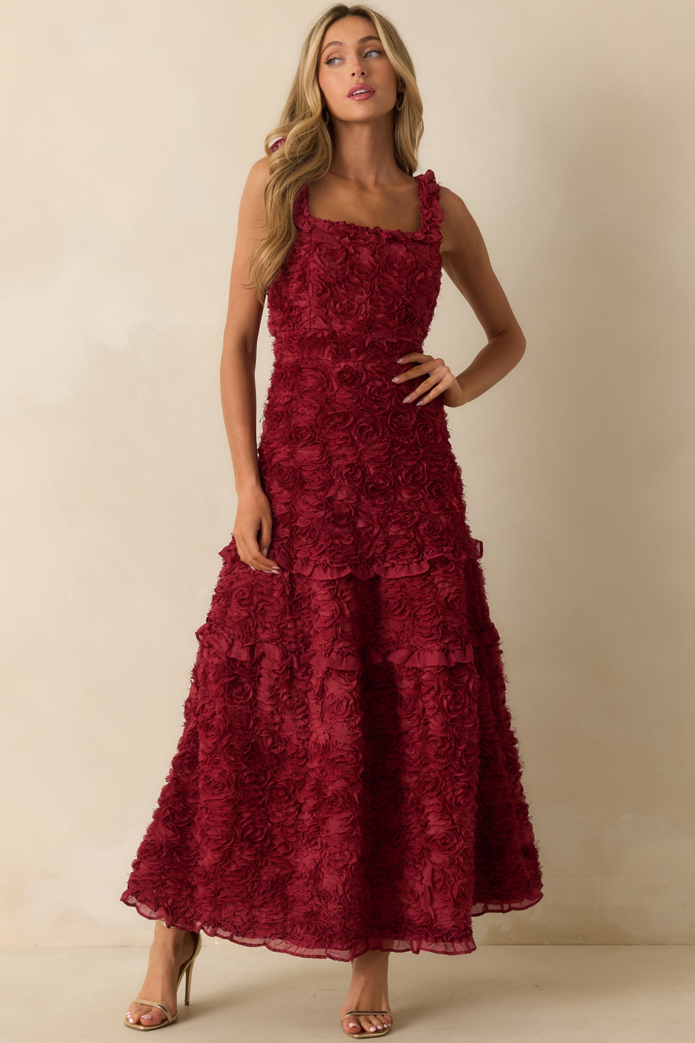 Statement dress highlighting ruffle trim and dimensional floral accents.