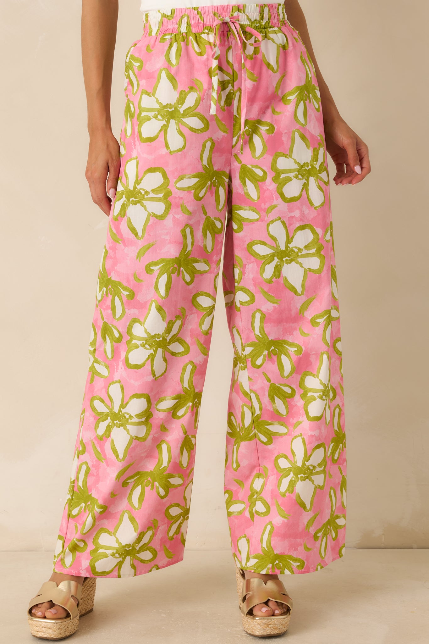 Statement pants featuring side seam pockets and a relaxed, draping wide-leg construction.