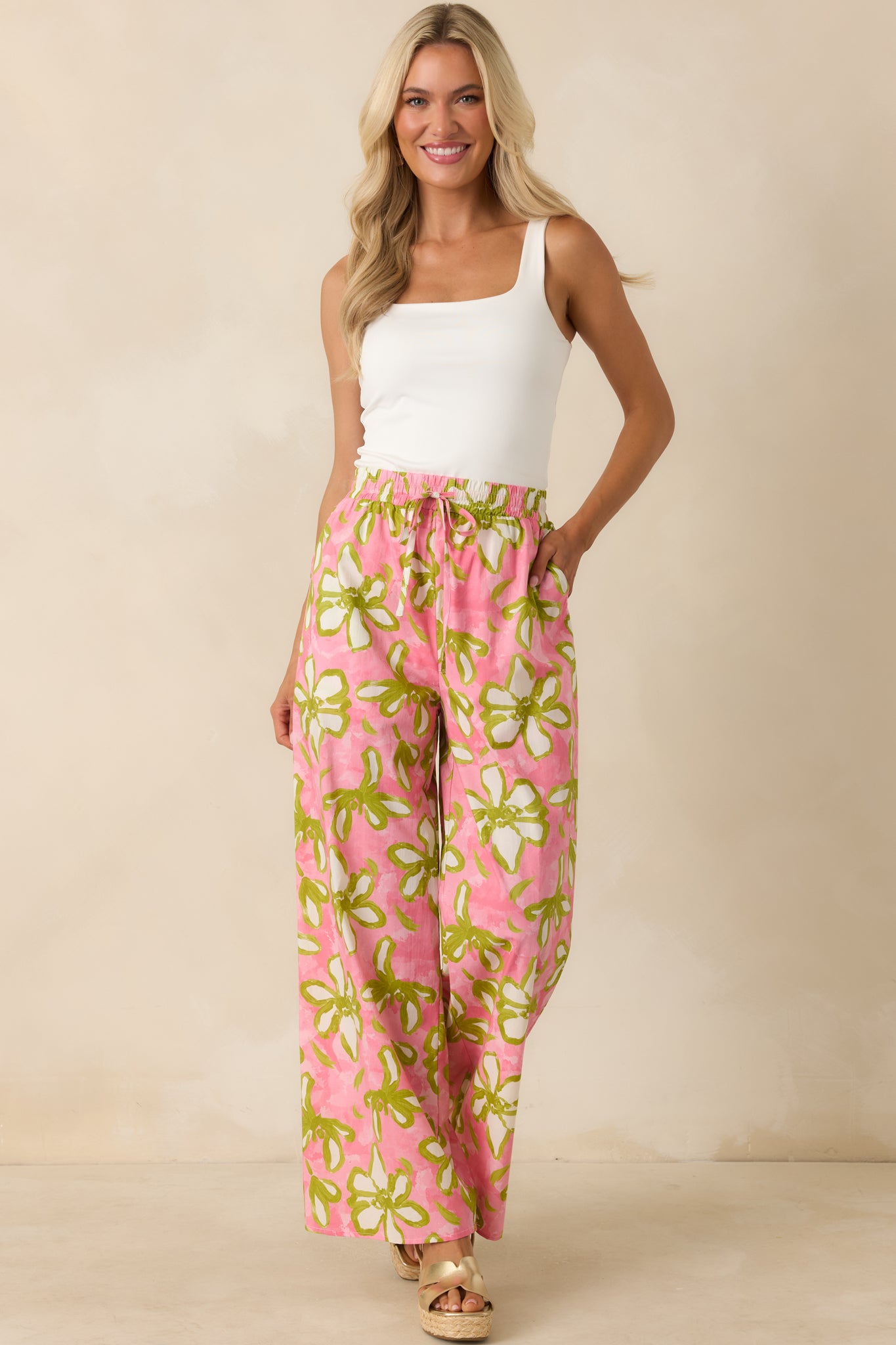 Statement wide-leg pants showcasing a flowing drape, full lining, and an easy pull-on fit with vibrant floral patterning.