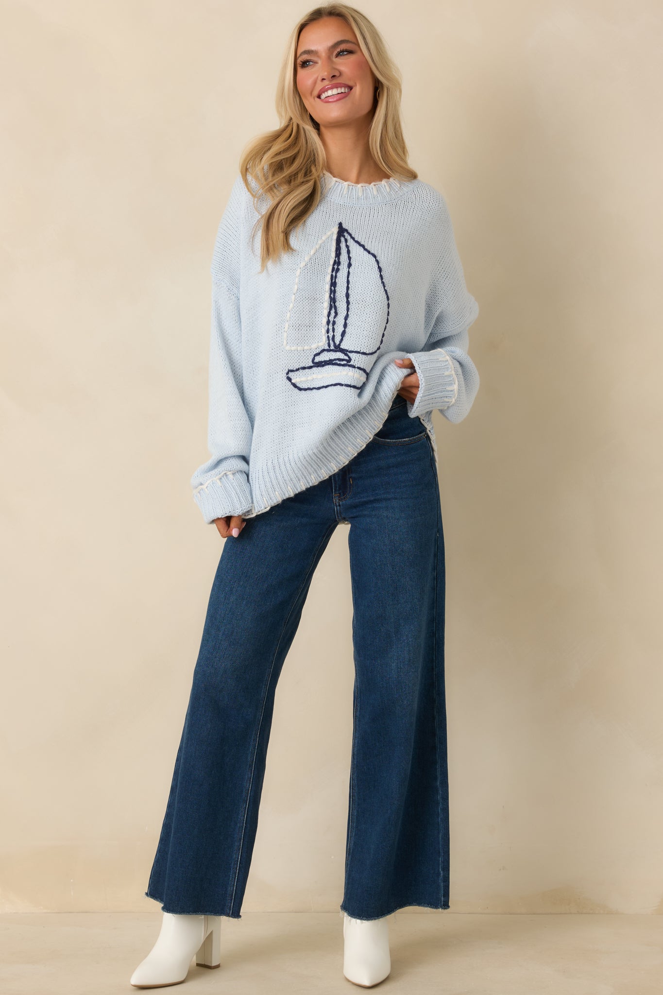 Straight-on front angle showing the comfortable layering fit and long sleeves of the knit top.