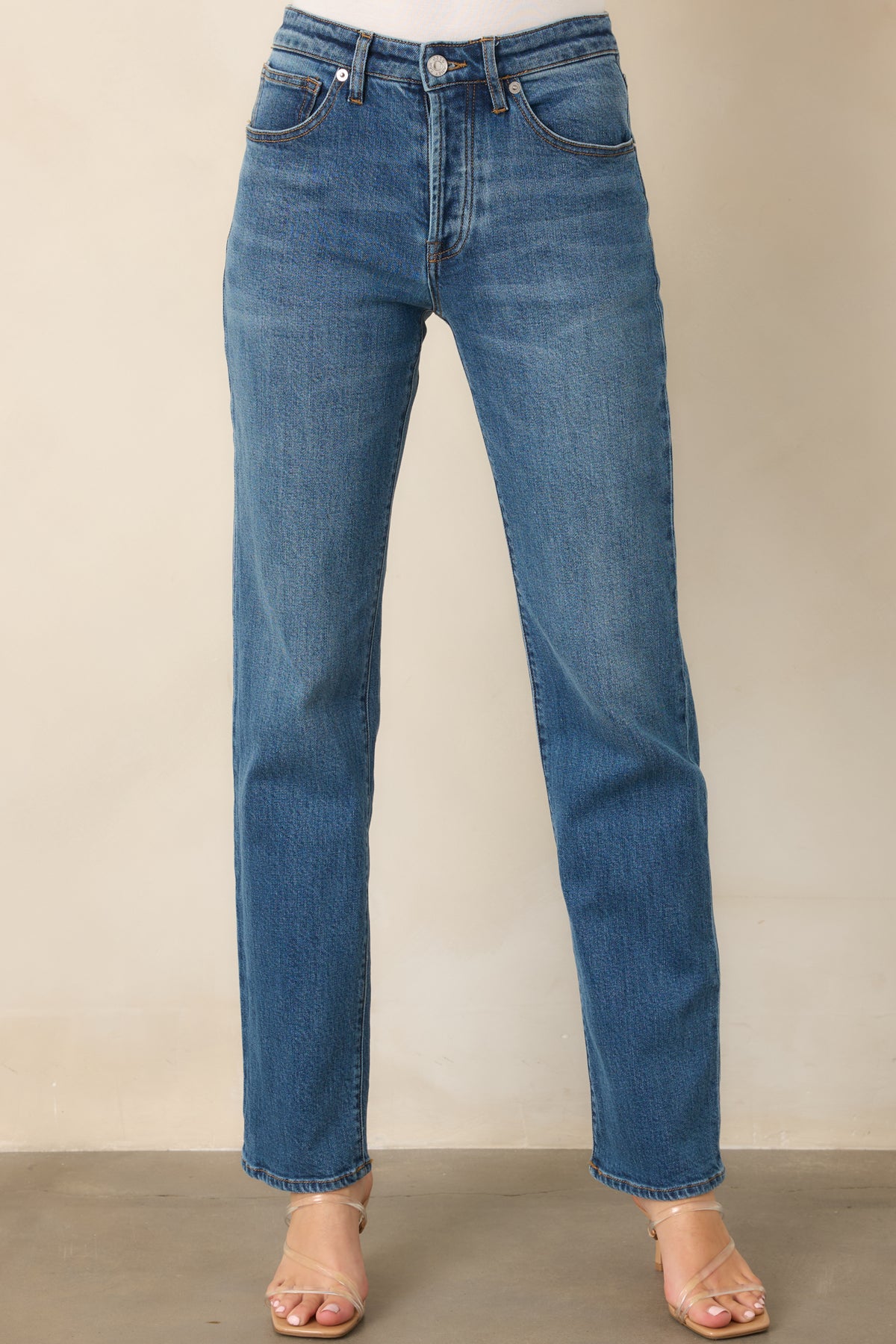 Straight-leg jeans highlighting the medium wash, subtle fading, and relaxed fit.