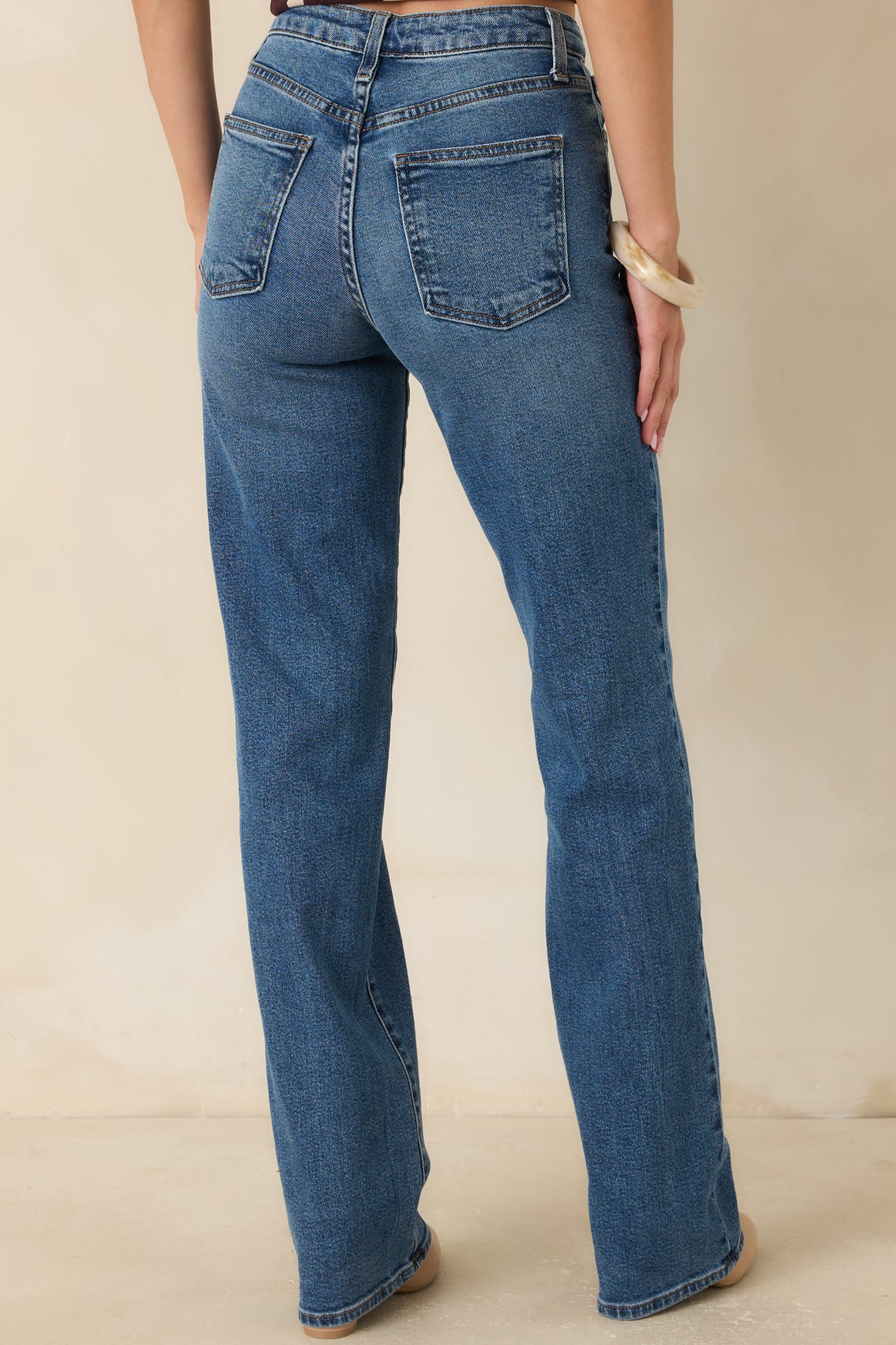 Back view of the straight-leg pants featuring a clean silhouette, longer inseam, and polished tailored finish.