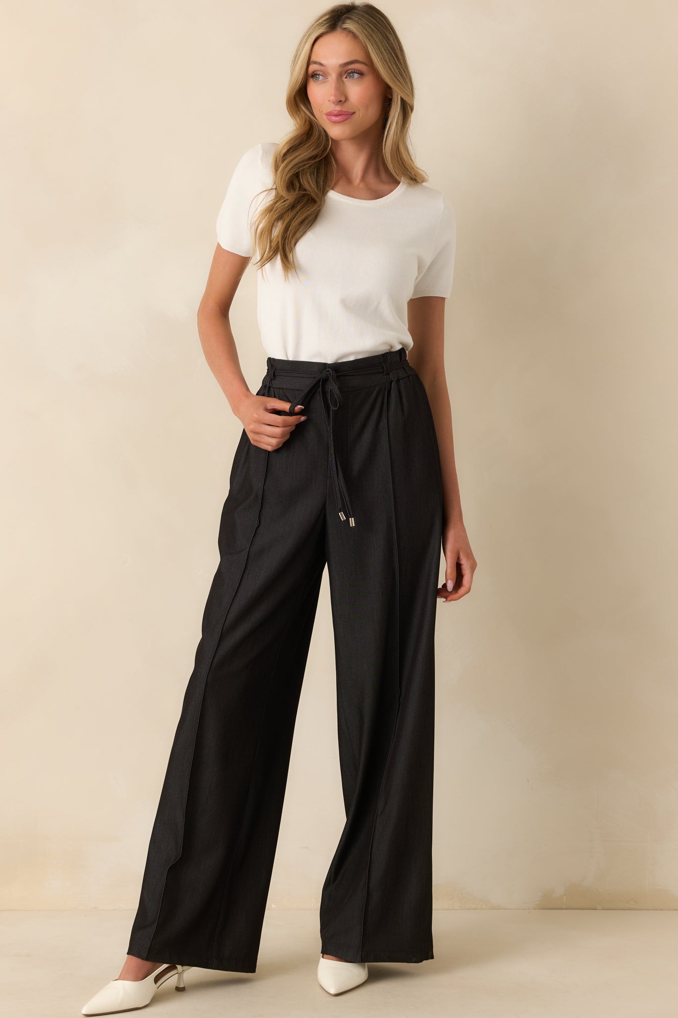 Straight-on full body image emphasizing the center leg seam details and overall fit.