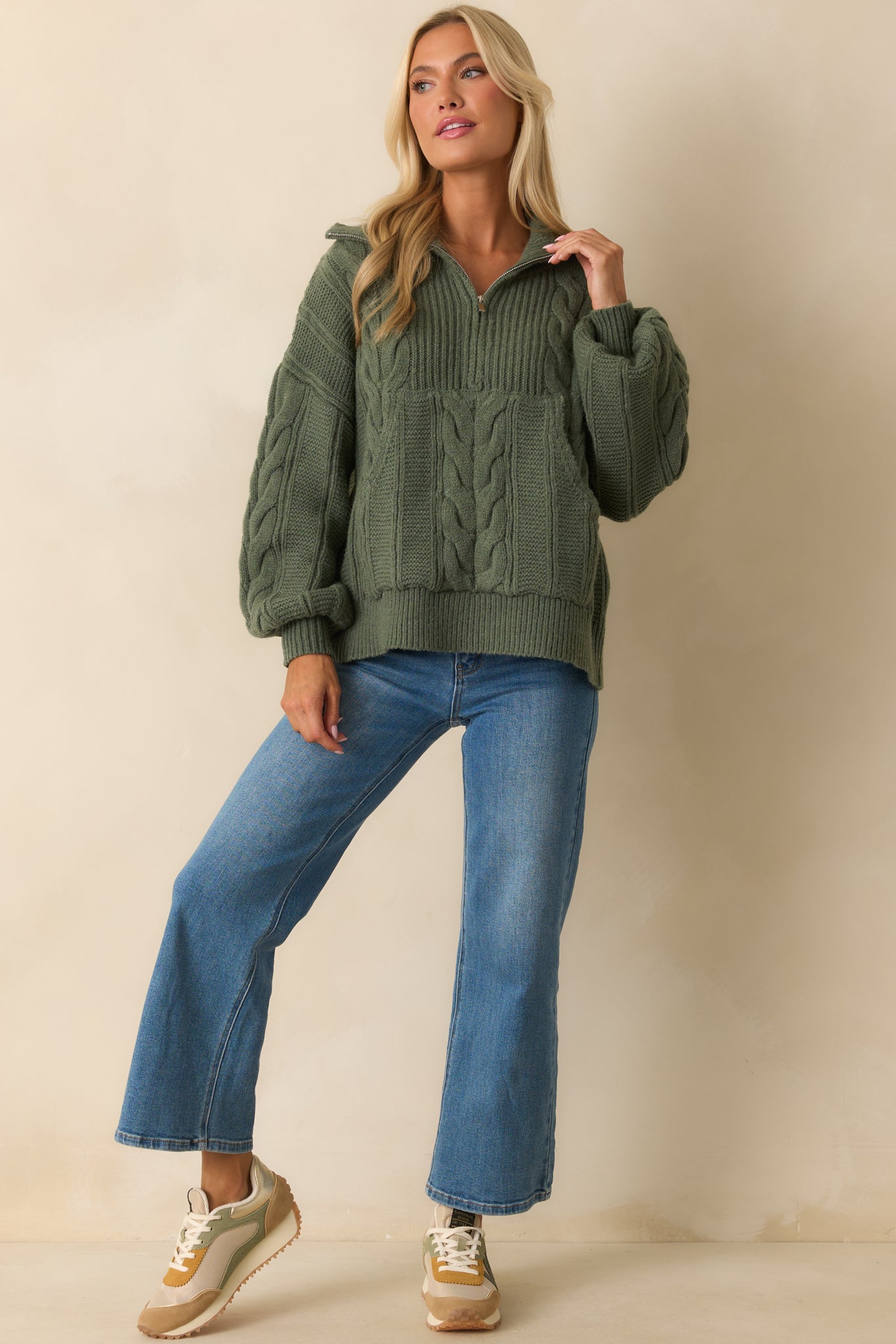 A straight-on angle highlighting the kangaroo pocket, ribbed hems, and long drop shoulder sleeves.