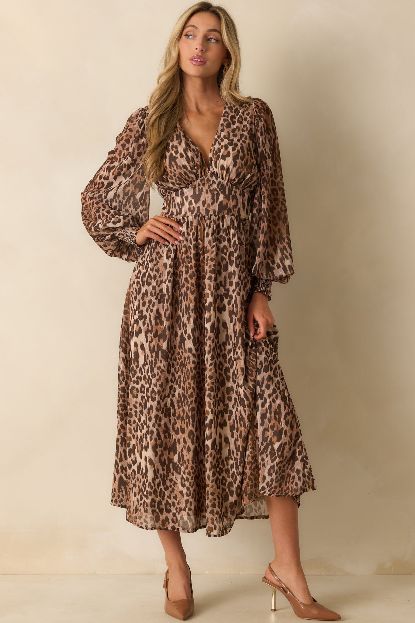 A straight-on view emphasizing the full-length tan lining and overall leopard print pattern.