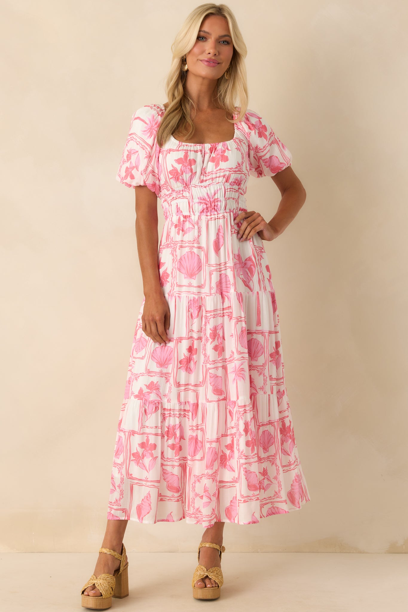 Straight-on view showing the puff sleeve shape, elastic cuffs, and full ivory lining beneath the printed fabric.