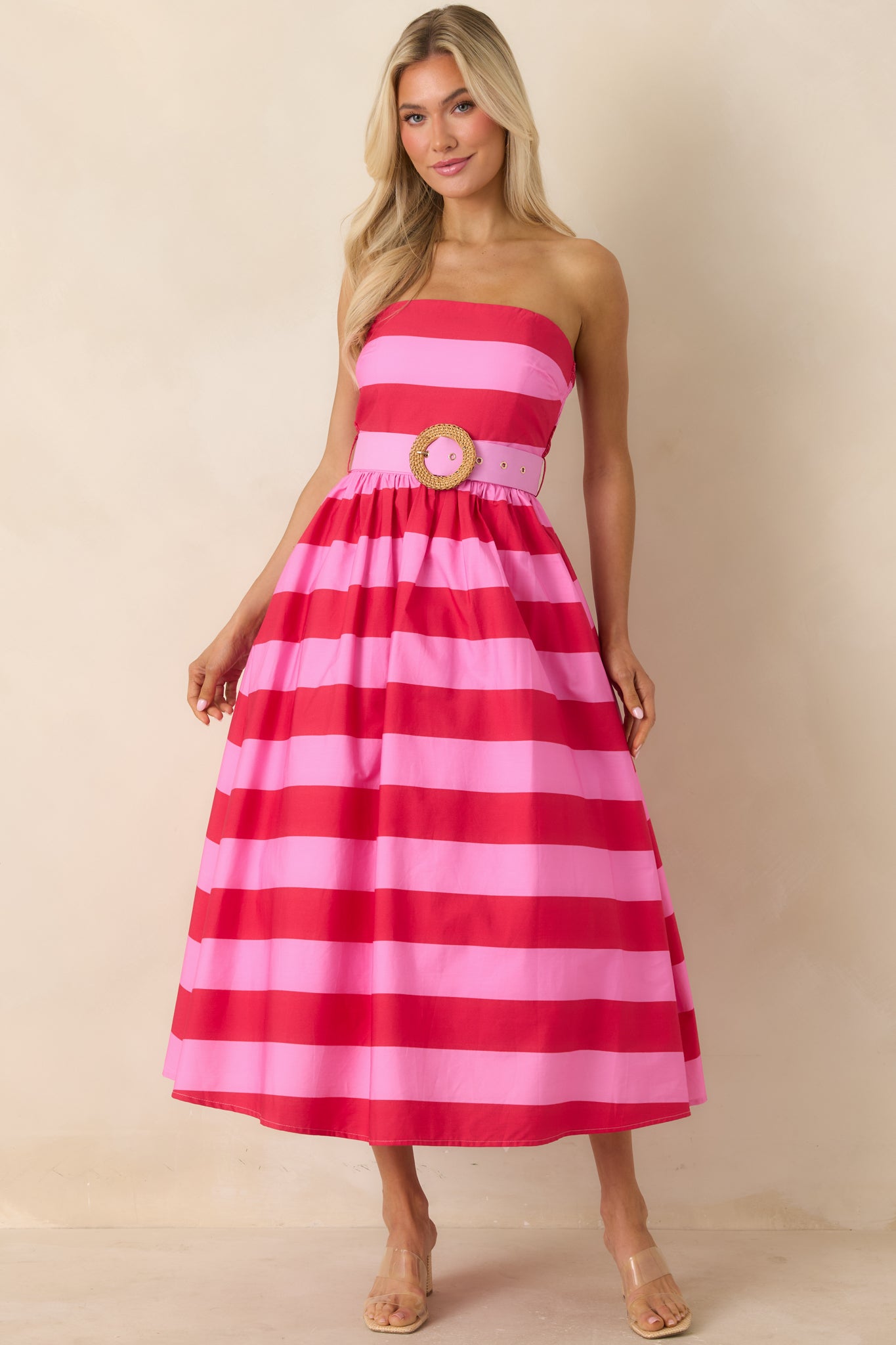 Strapless midi dress with bold striped pattern and structured bodice.