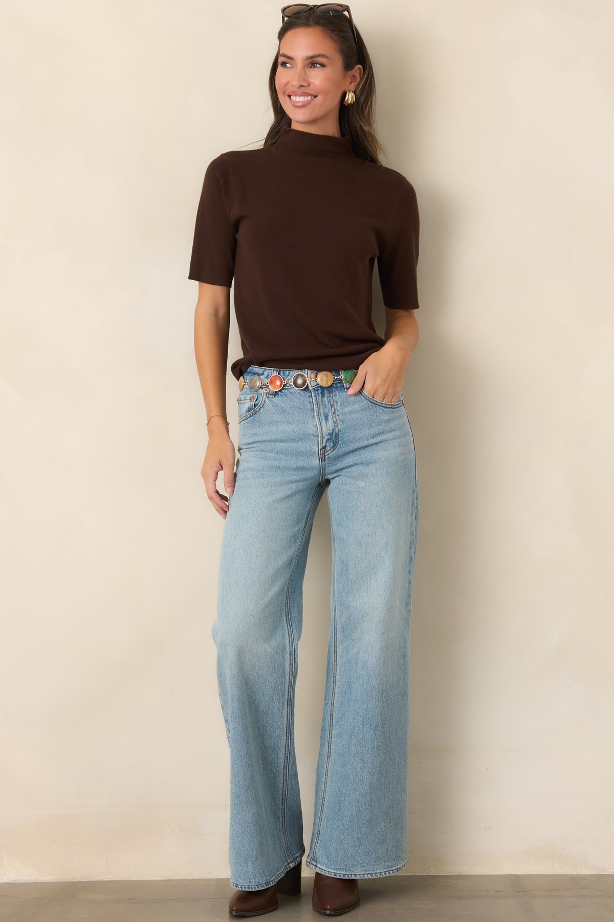 Streamlined knit top with a fitted high neckline and simple short sleeves.
